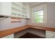 This home office has custom built-ins and lots of natural light which is perfect for getting work done at 2015 Dilworth E Rd, Charlotte, NC 28203