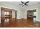 Hardwood floor living space featuring a view into the kitchen with stainless steel appliances at 2015 Dilworth E Rd, Charlotte, NC 28203