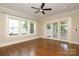 Bright living room featuring hardwood floors and sliding doors to a patio at 2015 Dilworth E Rd, Charlotte, NC 28203
