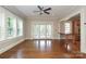 Open living space with hardwood floors and a view to an outdoor patio at 2015 Dilworth E Rd, Charlotte, NC 28203