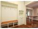 Mudroom with built-in bench, storage, and access to the backyard at 2015 Dilworth E Rd, Charlotte, NC 28203