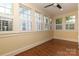 Sun-drenched room with hardwood floors and lots of windows at 2015 Dilworth E Rd, Charlotte, NC 28203