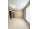 A serene bedroom features neutral walls, carpeted floors, and a window at 207 Morris St, Kings Mountain, NC 28086
