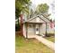 Charming single-story home with an American flag, inviting entrance and landscaped yard at 207 Morris St, Kings Mountain, NC 28086