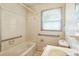 Neutral bathroom with a shower/tub combo and grab bars at 2106 A Ave, Charlotte, NC 28216