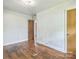 Spacious bedroom with hardwood floors, awaiting personal touches and style at 2106 A Ave, Charlotte, NC 28216
