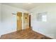 Bedroom with original hardwood floors and ample natural light at 2106 A Ave, Charlotte, NC 28216