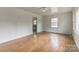Inviting living space featuring classic hardwood floors and abundant natural light at 2106 A Ave, Charlotte, NC 28216