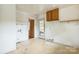 Functional utility room with cabinetry, door to exterior, and room for appliances at 2106 A Ave, Charlotte, NC 28216