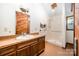 Bathroom featuring a walk-in shower and vanity with custom wood accents at 2415 Hargette Rd, Monroe, NC 28112
