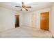 Spacious bedroom featuring neutral walls, carpet, and two closets for storage at 2415 Hargette Rd, Monroe, NC 28112