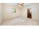 Bright bedroom with a ceiling fan, a window, and plush carpeting at 2415 Hargette Rd, Monroe, NC 28112