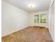 This bedroom offers natural light from dual windows, as well as a closet for storage at 2415 Hargette Rd, Monroe, NC 28112