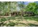 Traditional home with a covered porch and well-maintained lawn, perfect for enjoying the outdoors in a tranquil setting at 2415 Hargette Rd, Monroe, NC 28112