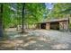 A view of the outside of a large garage style wooden building at 2415 Hargette Rd, Monroe, NC 28112