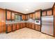 Functional kitchen featuring wood cabinets, neutral countertops, and stainless steel appliances, ideal for everyday cooking and dining at 2415 Hargette Rd, Monroe, NC 28112