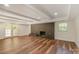 Basement with brick fireplace, recessed lighting, wood floors and french doors at 2528 Arnold Dr, Charlotte, NC 28205