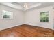 Bedroom with hardwood floors, white trim and ceiling fan at 2528 Arnold Dr, Charlotte, NC 28205