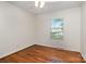 Bedroom with hardwood floors, white trim and ceiling fan at 2528 Arnold Dr, Charlotte, NC 28205