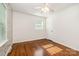Bedroom featuring hardwood floors, neutral walls, and bright windows at 2528 Arnold Dr, Charlotte, NC 28205