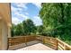 Enjoy the outdoors on the spacious wood deck overlooking lush greenery and a fenced yard at 2528 Arnold Dr, Charlotte, NC 28205