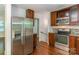 Kitchen with stainless steel appliances, dark wood cabinets, and granite countertops at 2528 Arnold Dr, Charlotte, NC 28205