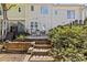 A stepped stone path leads to a private patio with an outdoor seating area at 2638 Dilworth Heights Ln, Charlotte, NC 28209
