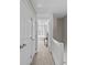 Upstairs hallway with carpet, white doors, and a view to a bedroom at 2638 Dilworth Heights Ln, Charlotte, NC 28209