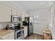 Modern kitchen featuring stainless steel appliances and light cabinets for a bright space at 2638 Dilworth Heights Ln, Charlotte, NC 28209