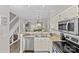 Kitchen view with stainless steel appliances, granite countertops, and an open design at 2638 Dilworth Heights Ln, Charlotte, NC 28209