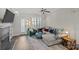 Cozy living room featuring a comfortable gray couch, patterned rug, and stylish decor at 2638 Dilworth Heights Ln, Charlotte, NC 28209