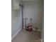Storage room with ceramic tile flooring, grey walls, and utilities at 301 E 11Th St, Kannapolis, NC 28083