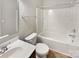 Clean bathroom with vanity sink, toilet, and shower-tub combo at 305 Augustus Ln, Mount Holly, NC 28120