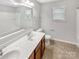 Bright bathroom featuring double vanity and shower-tub combo at 305 Augustus Ln, Mount Holly, NC 28120