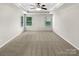 Spacious bedroom boasting a tray ceiling and neutral carpet at 305 Augustus Ln, Mount Holly, NC 28120