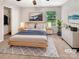 Serene bedroom featuring a comfortable bed, ample natural light, and neutral tones creating a relaxing atmosphere at 305 Augustus Ln, Mount Holly, NC 28120