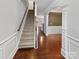 Inviting entryway with hardwood floors, staircase, and elegant trim work, setting a grand tone for the home at 305 Augustus Ln, Mount Holly, NC 28120