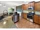 Well-equipped kitchen with modern appliances, sleek granite countertops, and efficient layout for culinary enthusiasts at 305 Augustus Ln, Mount Holly, NC 28120