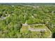 Aerial view of the property showcasing its location surrounded by lush greenery and neighborhood amenities at 308 Greenwood Pl, Belmont, NC 28012