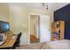 Well-lit bedroom featuring a dark accent wall, creating a cozy and stylish atmosphere at 308 Greenwood Pl, Belmont, NC 28012