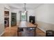 Inviting dining room featuring a long wooden table, chairs, and a view to the kitchen at 308 Greenwood Pl, Belmont, NC 28012