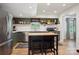Modern kitchen with stainless steel appliances, island, butcher block countertop, and stylish open shelving at 308 Greenwood Pl, Belmont, NC 28012