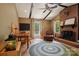 Cozy living room features a brick fireplace, vaulted ceiling with wood beams, and warm decor at 308 Greenwood Pl, Belmont, NC 28012