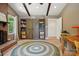 Inviting living room with brick fireplace, built-in shelving, exposed beams, and hardwood floors at 308 Greenwood Pl, Belmont, NC 28012