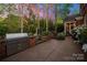 Outdoor kitchen and grill area with manicured garden and shade trees at 3301 Mcpherson St, Waxhaw, NC 28173