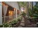 A backyard view of an enclosed brick porch and garden pathway at 3301 Mcpherson St, Waxhaw, NC 28173