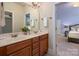 A bright bathroom offers double sinks, wood cabinetry, and ample counter space for everyday convenience at 3301 Mcpherson St, Waxhaw, NC 28173
