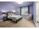 Comfortable bedroom with a Queen bed, side tables, reading lamps, and window at 3301 Mcpherson St, Waxhaw, NC 28173
