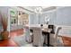 Formal dining room with hardwood floors, decorative molding, and designer light fixture at 3301 Mcpherson St, Waxhaw, NC 28173