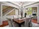 Dining area with hardwood floors, chandelier, and views into the adjacent living room and staircase at 3301 Mcpherson St, Waxhaw, NC 28173